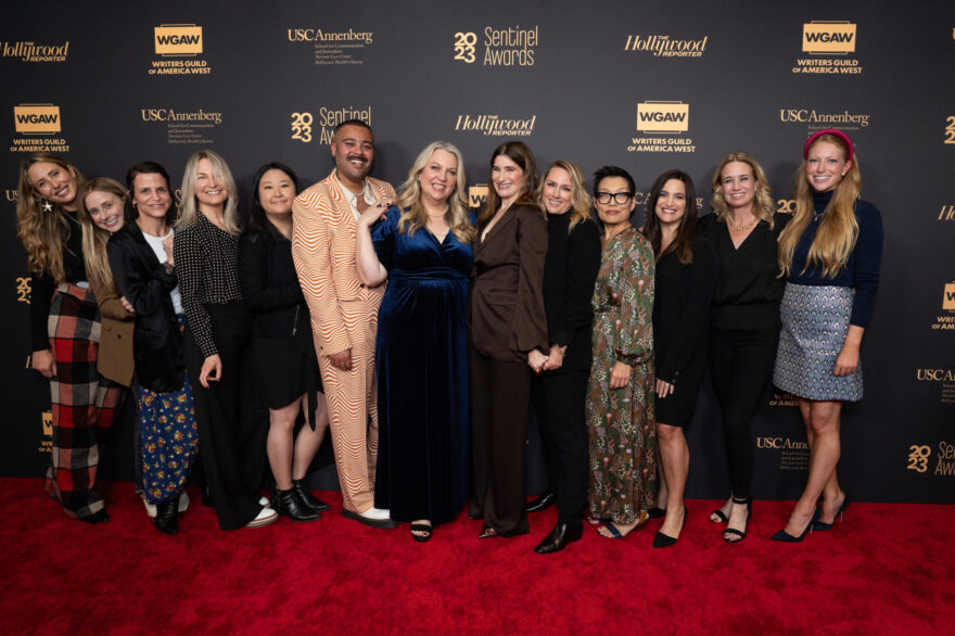 Actress Kathryn Hahn, center, and the creative team of Hulu's "Tiny Beautiful Things" pose on the red carpet at the 2023 Sentinel Awards.